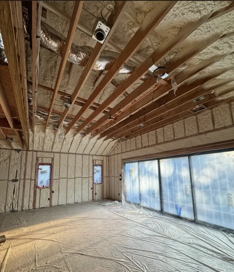 Interior walls and ceiling insulated with spray foam during new construction in Magna